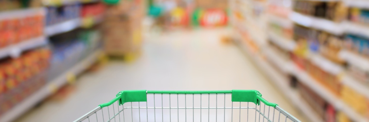 Grocery Shopping With Chronic Pain, Lipedema shopping cart in an aisle of a grocery store