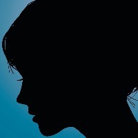 Silhouette of woman against a blue background