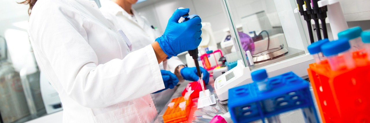 How Rare Disease Research Helps Common Illnesses Photo of female scientists researching in laboratory.