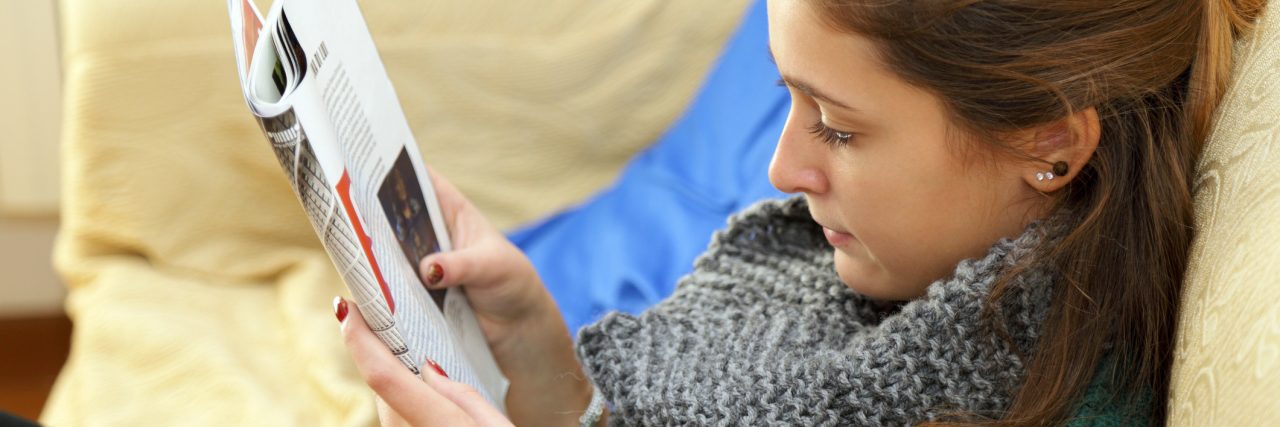 Coping With Societal Beauty Standards in Eating Disorder Recovery girl reading a women's magazine
