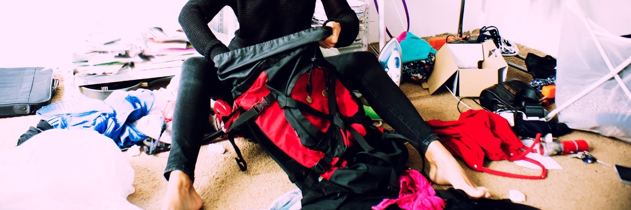 Depression Makes My Body Feel Heavy woman is packing backpack in a messy room