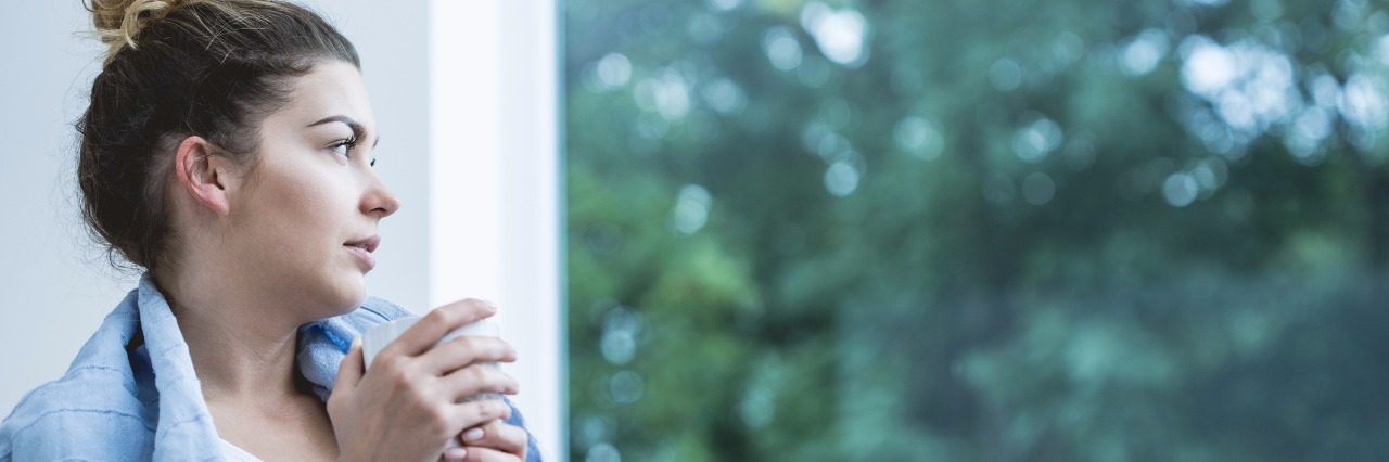Why to Reach Out to People Chronically Sick at Home Young woman drinking coffee in bed