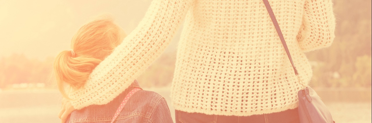 What It's Like Being a Parent With Bipolar Disorder Mother and daughter enjoying the view on a lake.