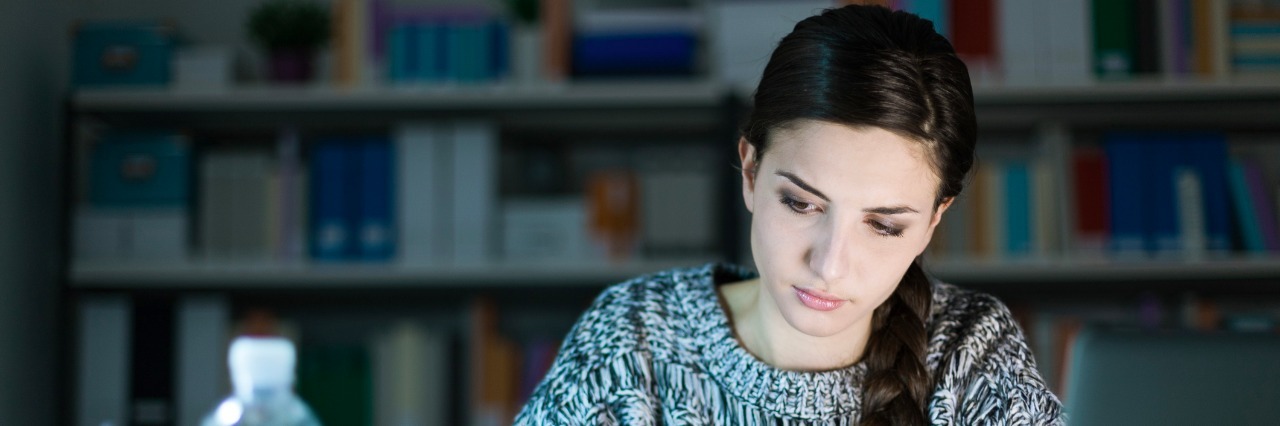 I'm Learning to Forgive Myself for Who I Was With My Eating Disorder Young woman doing homework