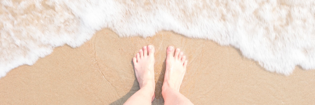 Description of Being 'High-Functioning' With GAD bare feet standing on the beach by the water