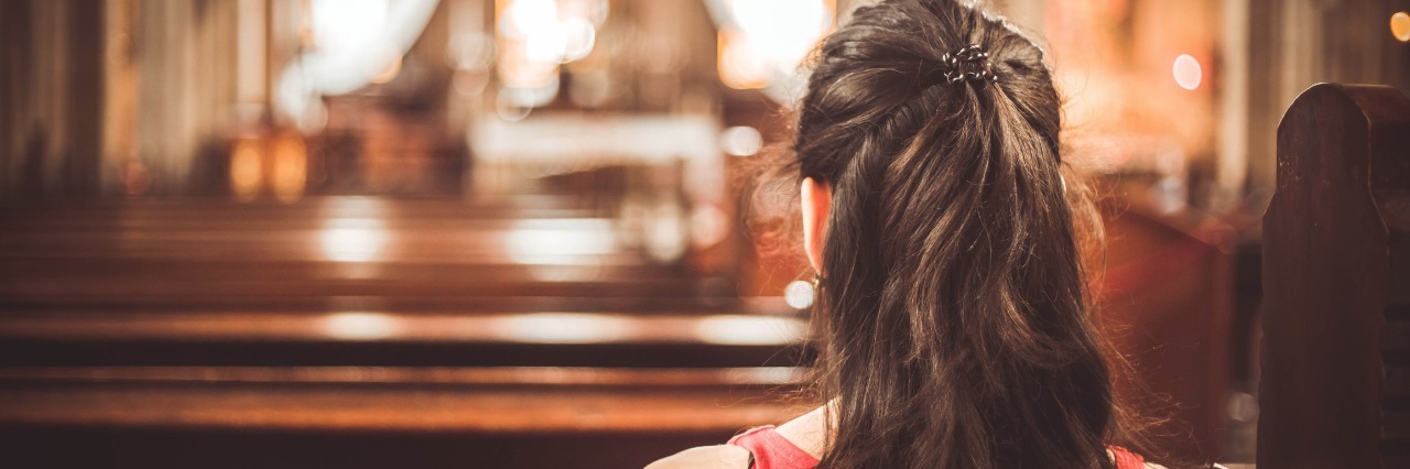 What the Church Should Know About People With Chronic Illness woman sitting in a pew of a church