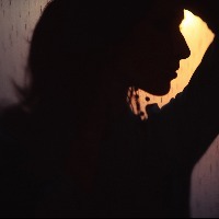 dark profile of a woman at sunset