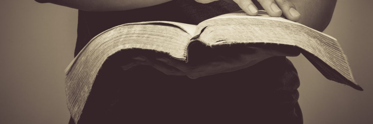 The Bible's 'Do Not Be Afraid' Means Something Different When You Have Vintage tone of man reading the Holy Bible.