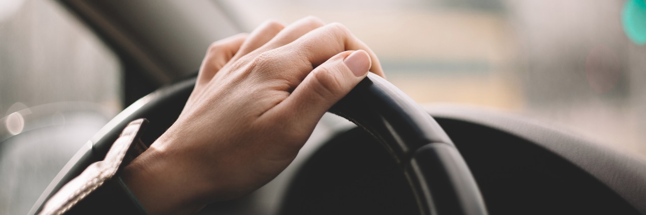 When You Get Anxiety and Panic Attacks at the Prospect of Driving Close-up of a woman's hand driving a car