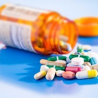 Pills and capsules in medical vial