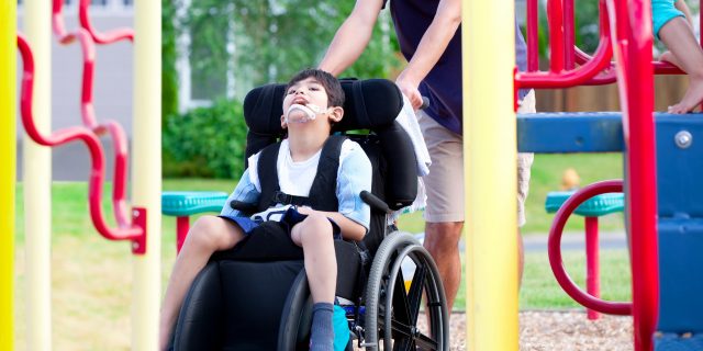 Boy in wheelchair at the playground.