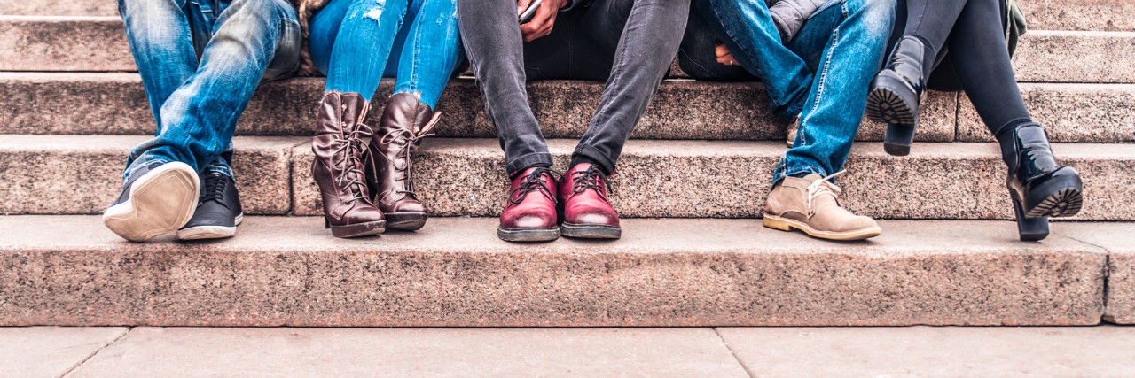 Telling My Friends About My Anxiety and Depression Group of people sitting on a staircase outdoors, close up on low section body - Multiracial friends talking and having fun on a meeting outdoors