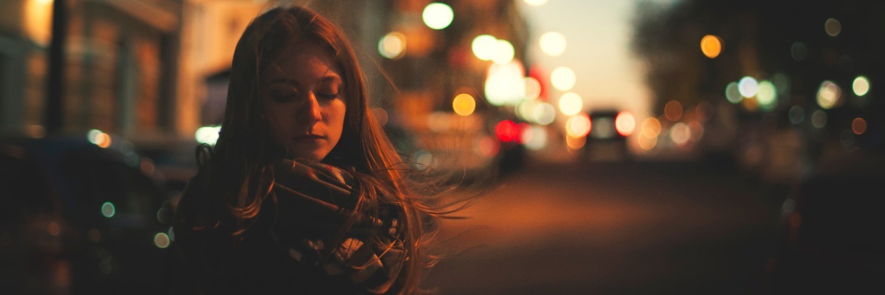 What Complex Regional Pain Syndrome Feels Like woman is walking alone on the night street