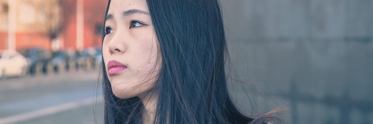 How I Learned to Accept Treatment (Finally) for My Eating Disorder Young beautiful Chinese girl with headphones