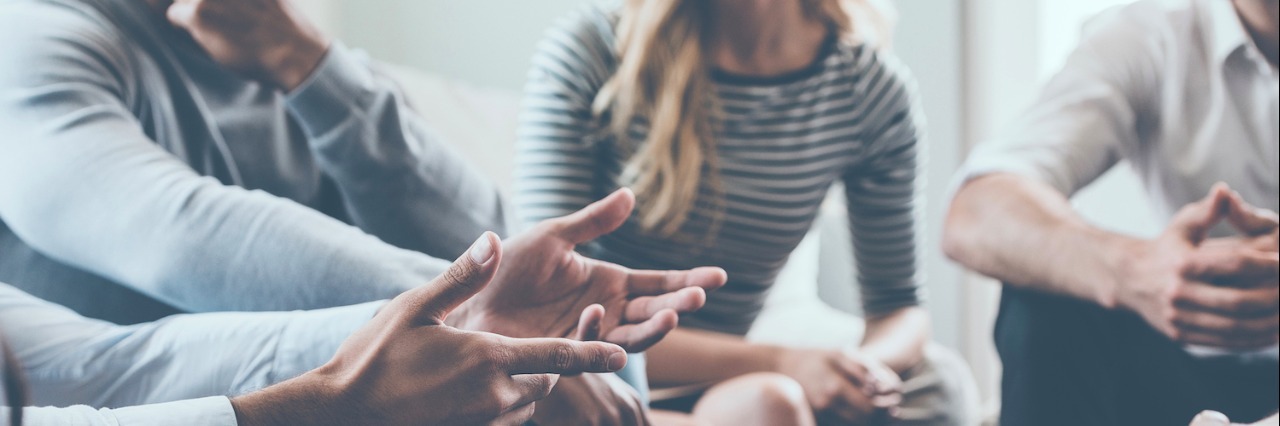 How an Adult Autism Support Group Can Reduce Loneliness People sitting in circle, having a discussion