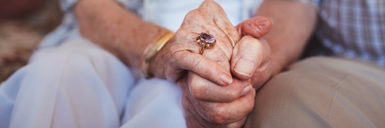 Building a Relationship as a Couple With Disabilities Couple holding hands.