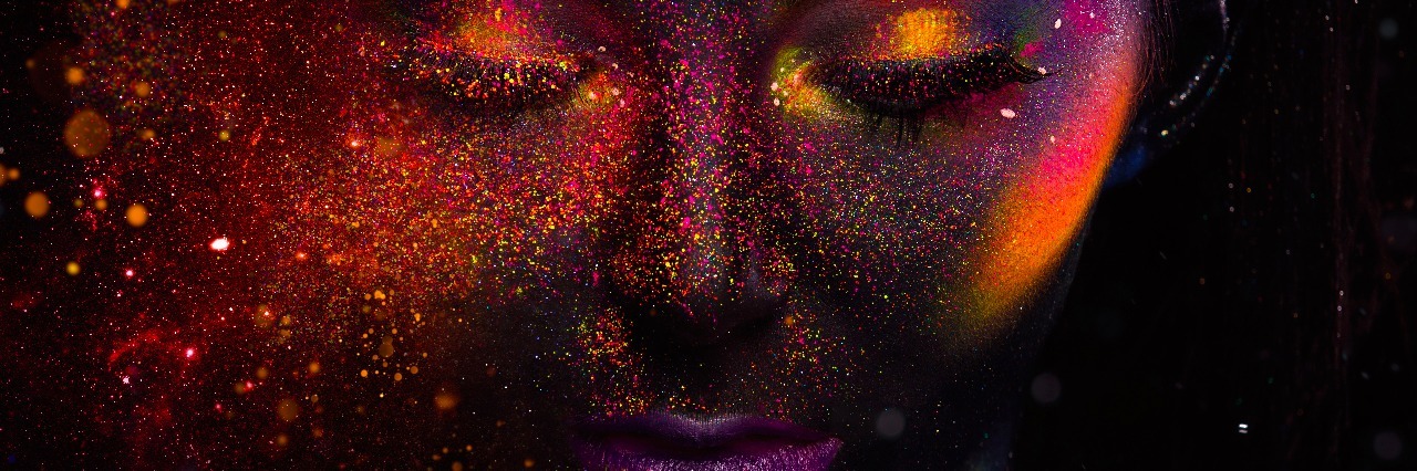 Bright neon make-up, creative body art on the theme of space and stars