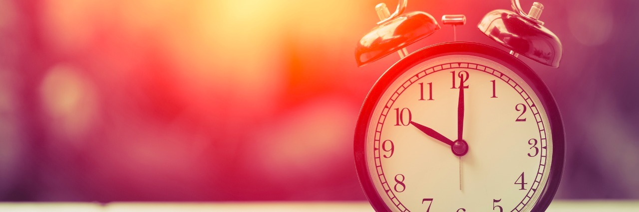 The 'Rule of 3' That Helps With My Fibromyalgia and Chronic Fatigue 10 o'clock Clock Classic Vintage Retro Color Tone on Wood Table with Sun Light