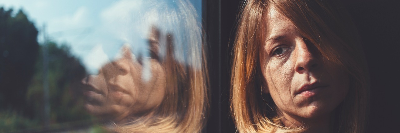 A Day in My Life With Borderline Personality Disorder Woman in train alone and sad