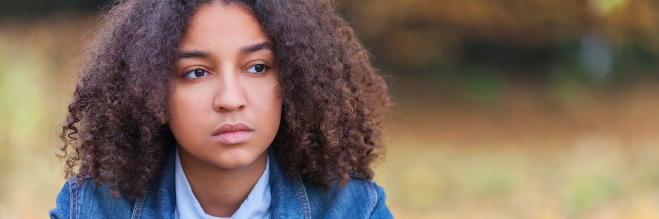 Being Called 'Attention Seeking' When You Live With a Mental Illness woman drinking coffee, looking sad