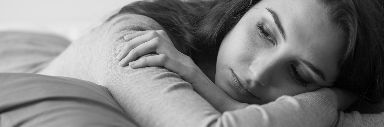 What Daily Life Is Like Working Part-Time With Chronic Fatigue young woman lying on the bed at home