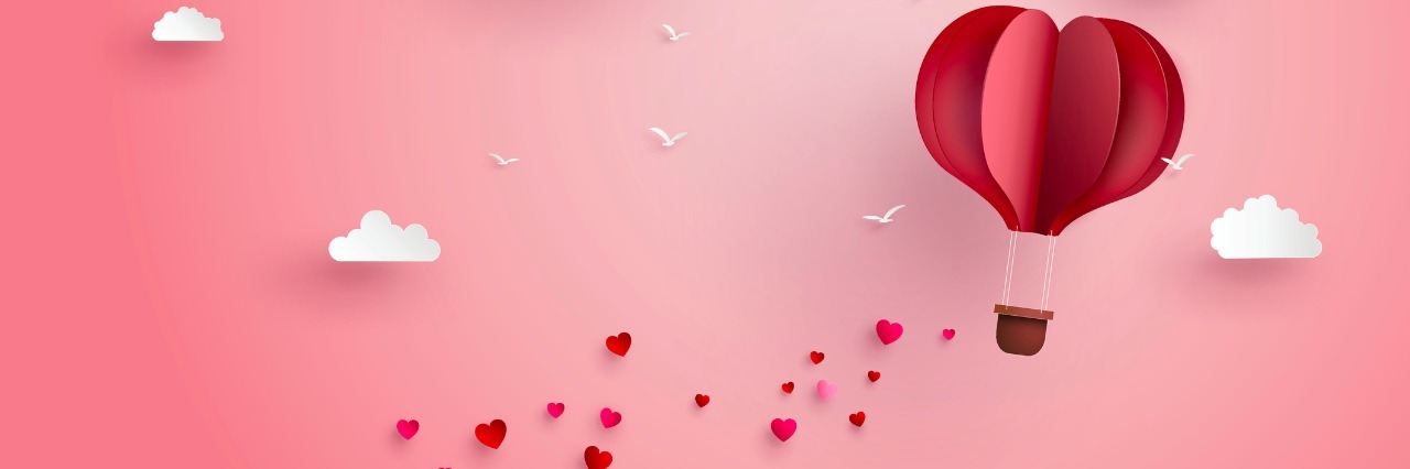 pink hot air balloon and hearts trailing behind, made out of paper
