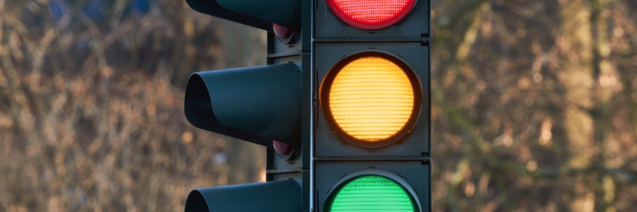 traffic light showing colors red, yellow, and green