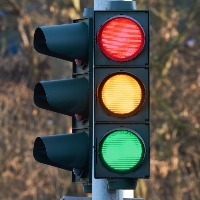 traffic light showing colors red, yellow, and green