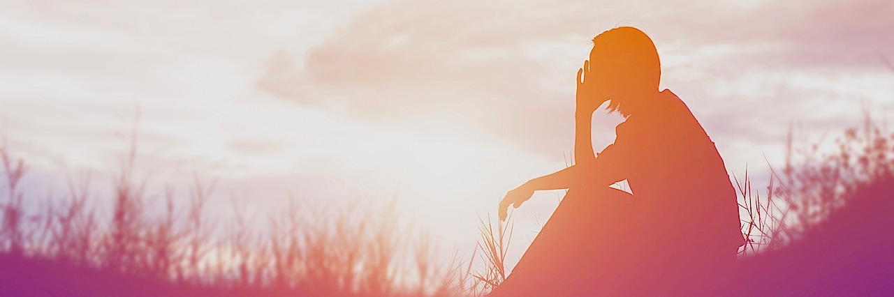 6 Confessions of Someone With a Mental Illness a shadow of a figure sitting in a field