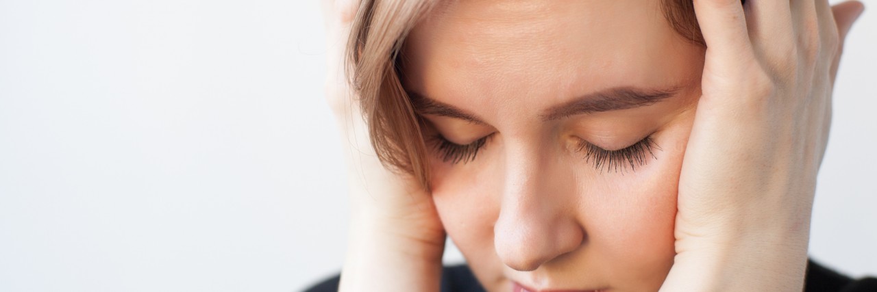 What OCD Obsessions Are Really Like Girl closes her ears in depression