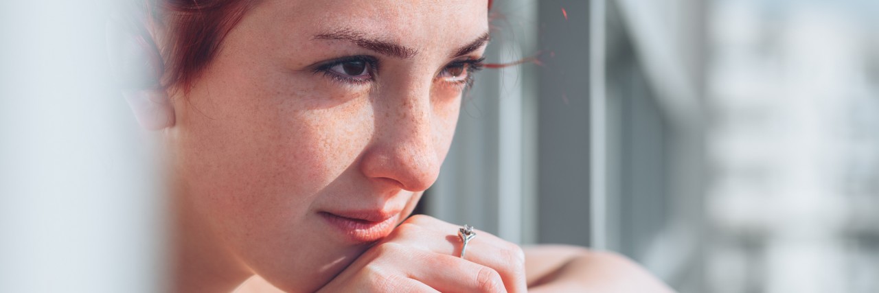 What You Can't See About My Anxiety Young girl looking from the balcony