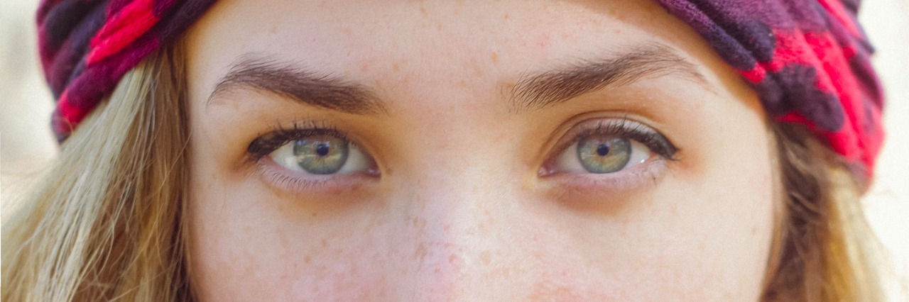 What Depression Recovery Is Like: Fighting for Yourself Is Worth It Young blonde girl with bandana looking through camera.