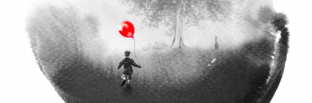 An image of a small child holding a balloon