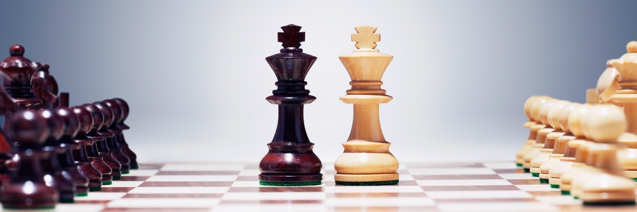 Our Health Conditions Are Not Competitions chess board with king pieces next to each other