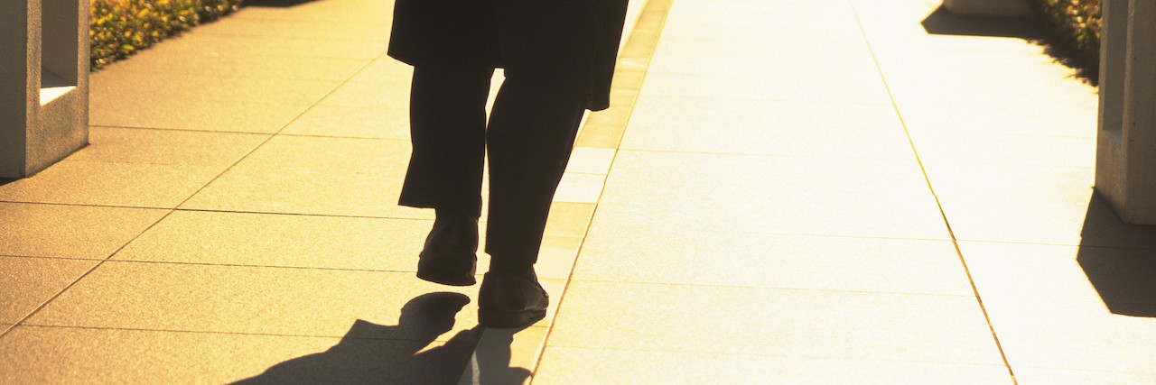 When Friends and Family Go Quiet After a Suicide man walking down the street