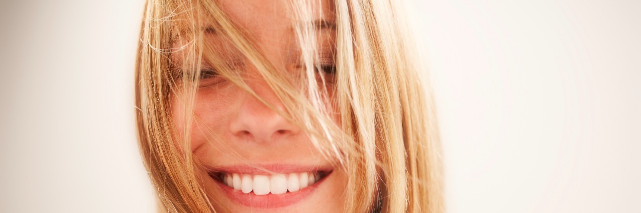 26 Things I've Learned From Living With a Mental Health Condition Young woman, eyes closed portrait