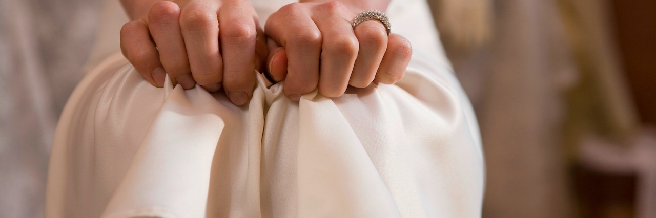 Fight, Flight and Freeze: My Experience of Anxiety Attacks woman clutching dress