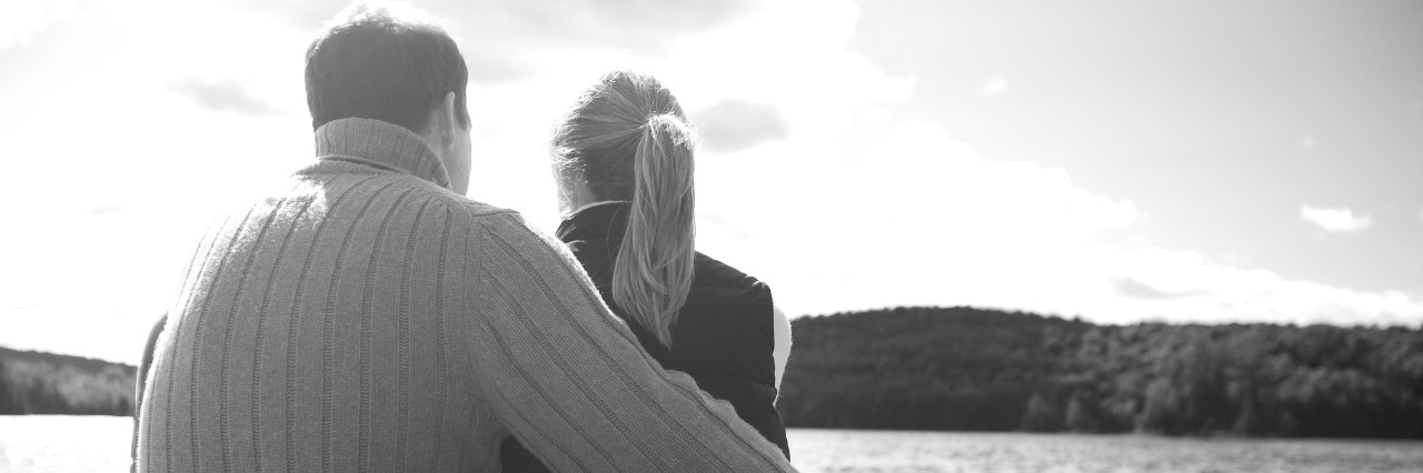 What Is My Husband Thinking as He Looks at His Chronically Ill Wife? Couple sitting on dock in lake