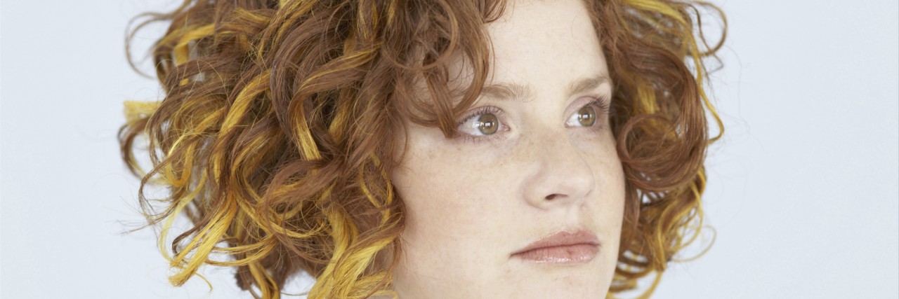 When Is It Time to Start Life Again While in Mental Illness Recovery? Portrait of young woman looking away