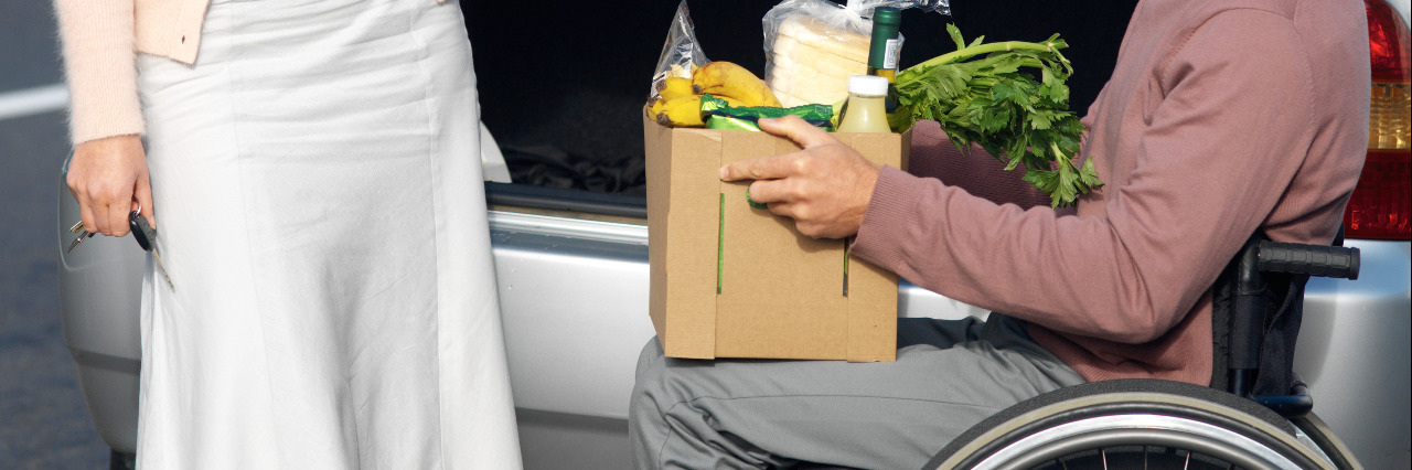 Please Don't Misuse the Word Inspiration When Discussing Disability Man in a wheelchair holding groceries.