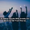A group of friends holding sparklers at night. Text reads: 20 things people with anxiety are too afraid to tell their friends