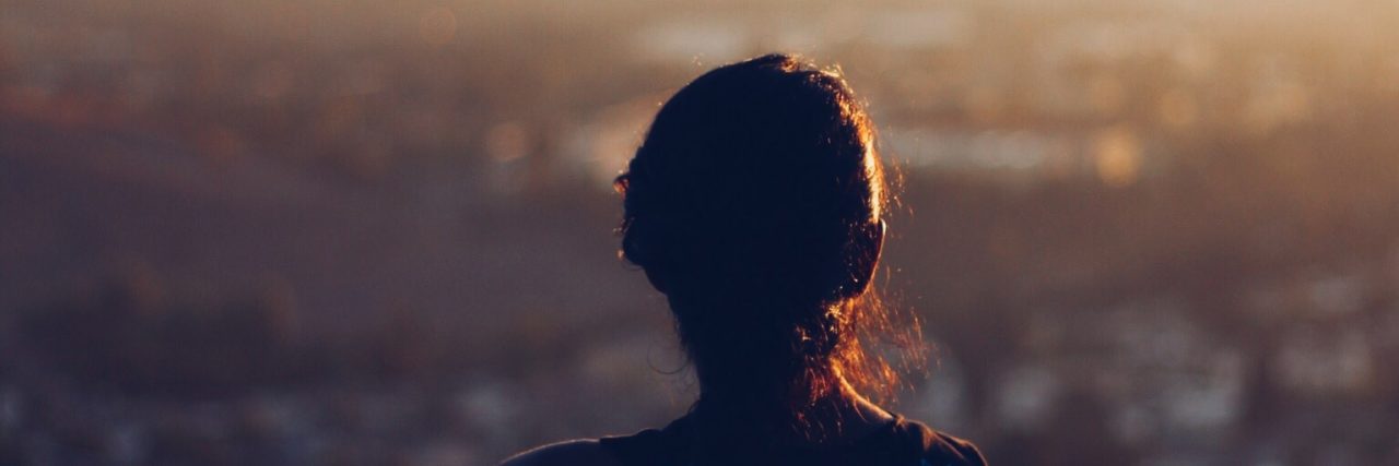 Anxiety and Self-Sabotage: Why Do I Feel Like a Failure? woman looking at los angeles skyline