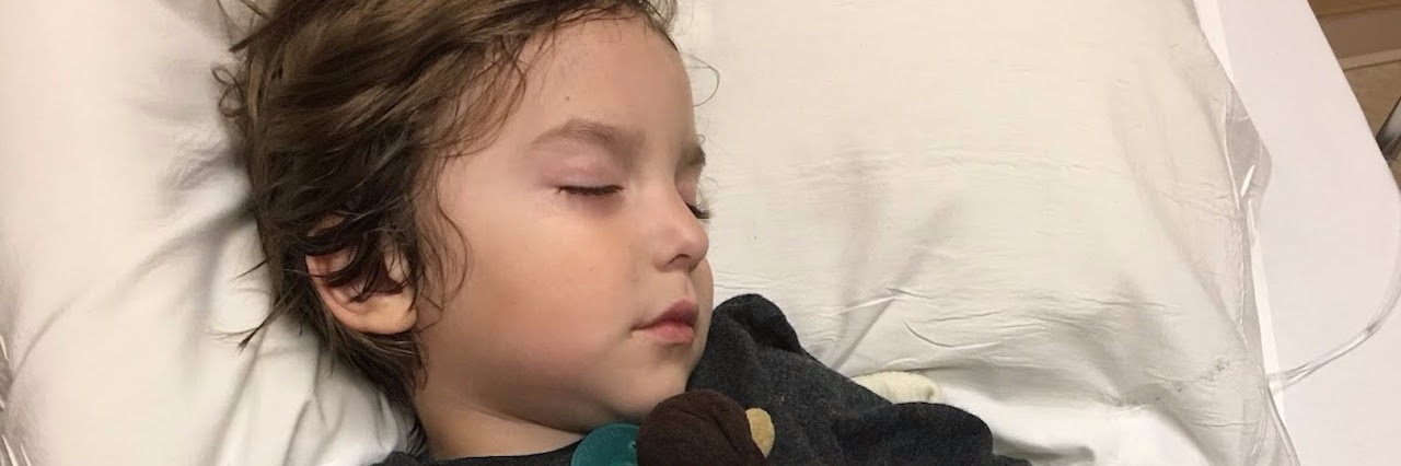Searching for a Diagnosis and Trying to Give My Child a 'Normal' Life little boy asleep in the hospital