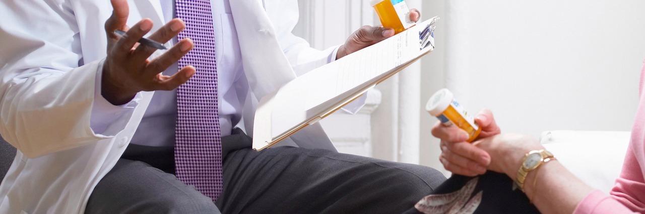 What the Medical Field Needs to Accept About Chronic Illness Doctor and Patient Discussing Medication