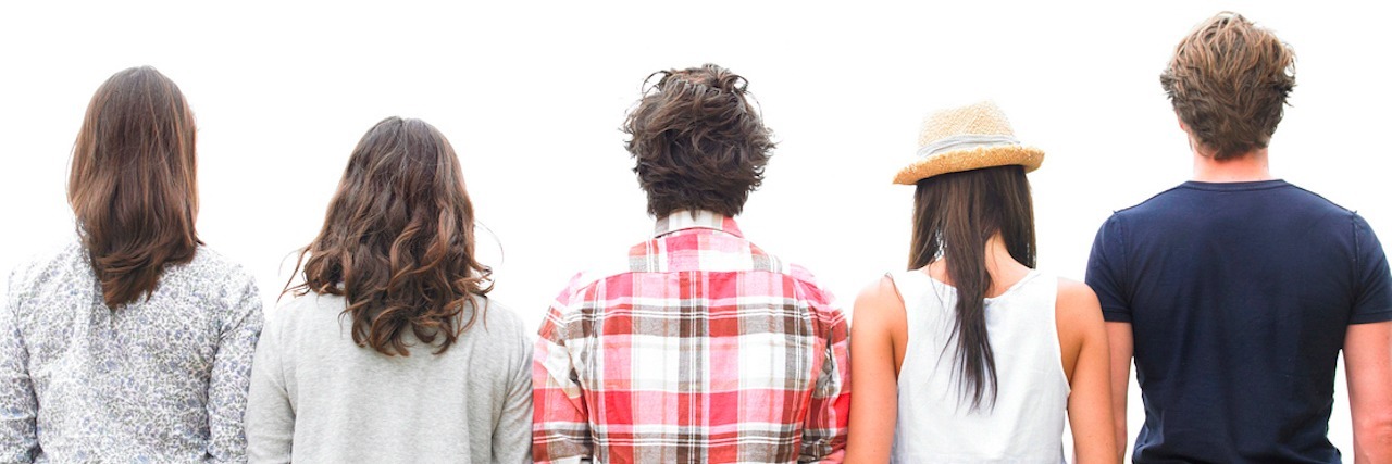 The Five People You Meet When Fighting Chronic Illness Rear view of friends standing on stone wall