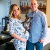 Pregnant woman with her husband and dog.