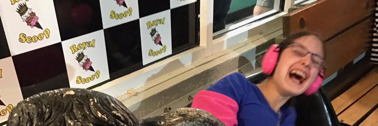 I Want Funding for Autism Support -- Not for Finding a Cause woman laughing at a state fair