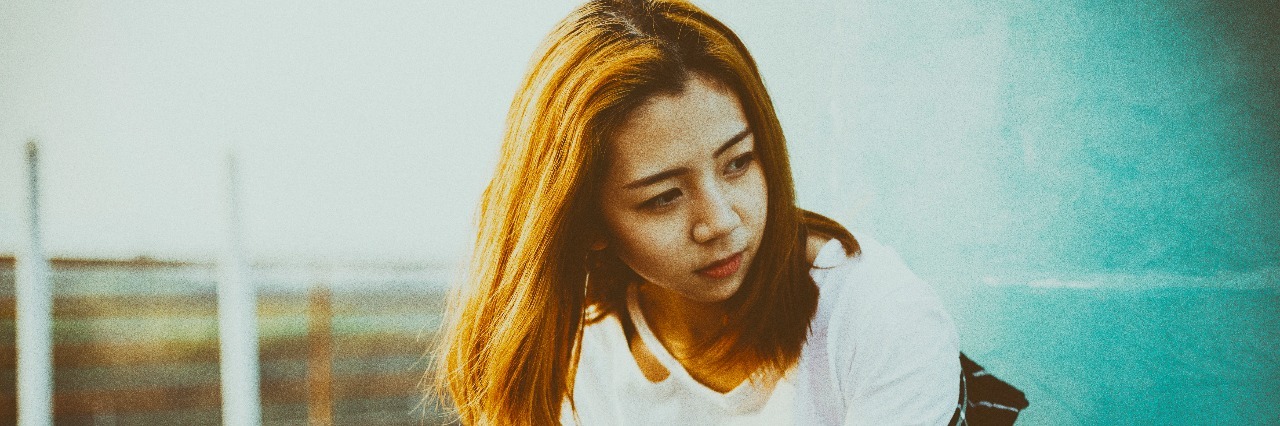 The Thoughts of a Socially Anxious Individual woman standing dramatically on a porch