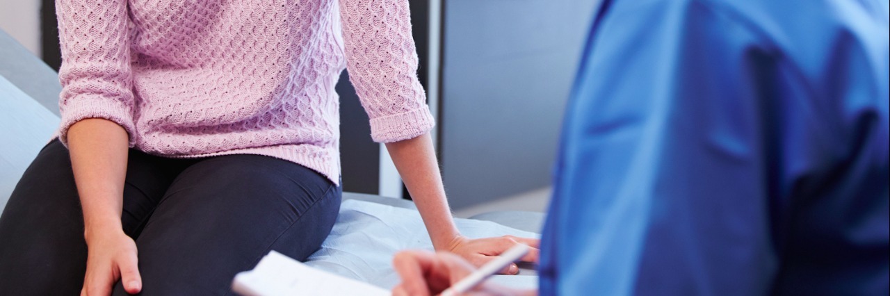 Why I'm Choosing to Talk Openly About My Skin Cancer patient and doctor having conversation in exam room