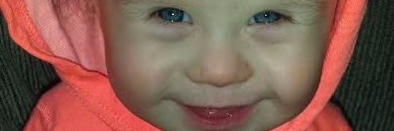 My First Year as a Mom of a Child With Down Syndrome Baby boy wearing hoodie, smiling